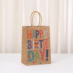 Brown kraft paper gift bag with colorful Happy Birthday lettering and woven handles