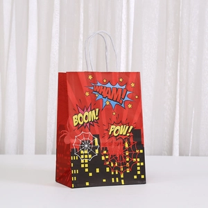Detail of red cartoon hero kraft paper gift bag with comic sound effects and white rope handle