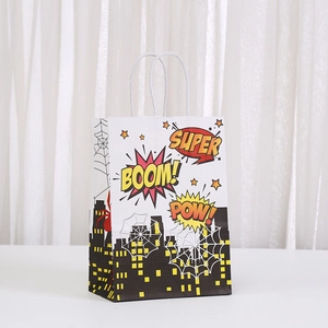 Close-up of comic superhero paper gift bag featuring BOOM and POW graphics with rope handles