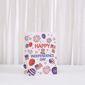 Close-up of Independence Day paper gift bag with festive fireworks and star prints