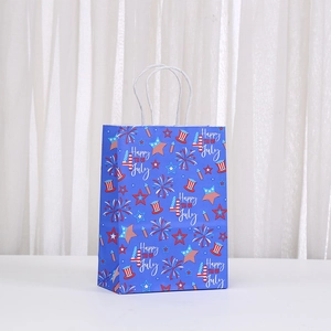 Happy 4th of July blue gift bag with red and white stars and white rope handle