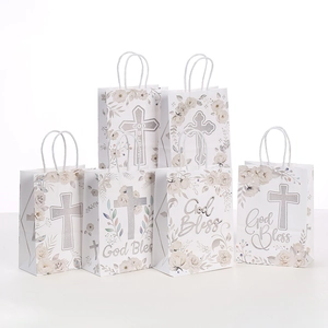 Religious gift bags with silver glitter cross and flowers for baptism favors