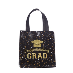 Black and gold graduation non-woven gift bag with Congratulations GRAD and cap print