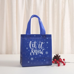 Blue 'Let It Snow' non-woven gift bag with white snowflakes for Christmas holiday shopping
