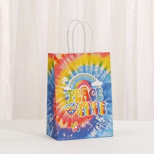 Colorful tie-dye paper gift bag with Peace Love print and white twisted rope handles