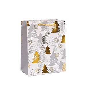 White Christmas paper gift bag with golden snowflake and tree patterns and rope handle