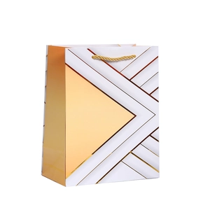 White and champagne gold geometric triangle pattern paper gift bag with rope handles