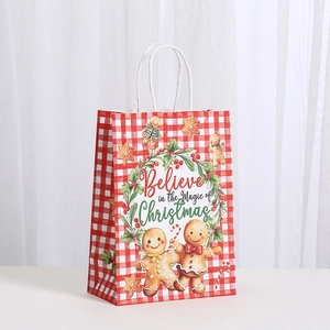 Sac cadeau de Noël en papier avec bonhomme de pain d'épices et motif à carreaux