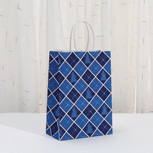 Blue Christmas paper gift bag with plaid tree pattern and white twisted rope handles