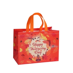 Red Happy Thanksgiving non-woven gift bag with turkey and autumn leaves motifs