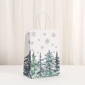 Detail of white kraft gift bag with festive forest print and sturdy paper rope handle