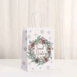 Detail of white kraft paper gift bag with Sweet Winter wreath and rope handles