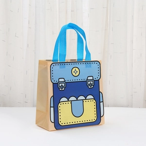 Close-up of non-woven shopping bag with colorful cartoon backpack print and blue handles