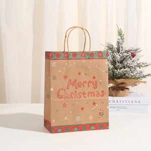 Brown kraft Christmas paper gift bag with red Merry Christmas text and snowflake patterns