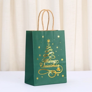 Green kraft Christmas gift bag with gold foil tree and handles for holiday parties