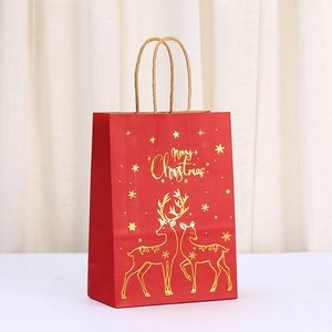 Red Christmas kraft paper gift bag with gold foil reindeer and Merry Christmas print
