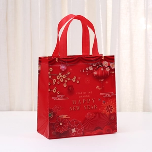 Red non-woven Lunar New Year gift bag with gold Year of the Dragon festive print