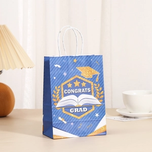 Blue graduation paper gift bag with gold stars and Congrats Grad text and white rope handle