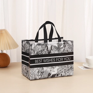 Waterproof non-woven tote bag with black and white tropical animal prints and sturdy handles