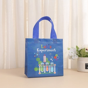 Blue non-woven gift bag with science experiment patterns and Let's Experiment text