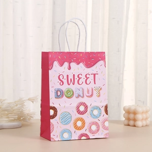 Pink kraft paper gift bag featuring sweet donut prints and white cord handles for party favors