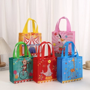 Detail of colorful circus-themed non-woven gift bags with reinforced handles for kids