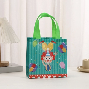 Detail of waterproof non-woven gift bag with colorful clown print and green handles