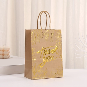 Brown kraft paper gift bag with gold foil Thank You text and leaf patterns