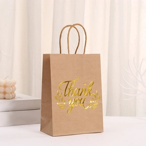 Brown kraft Thank You gift bag with gold foil lettering and twisted paper handles