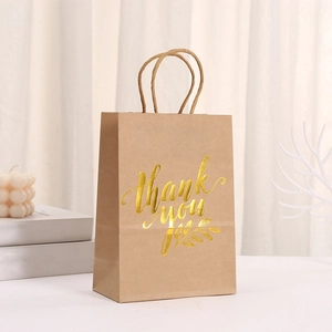 Brown kraft paper gift bag with gold foil thank you text and natural twine handles