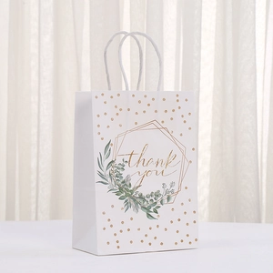 White kraft paper gift bag with golden Thank You lettering and green leaf details