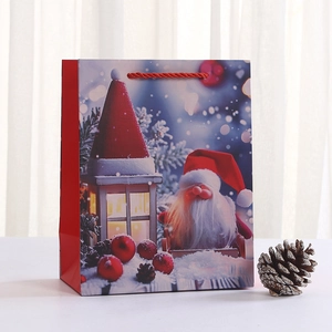 Sac cadeau de Noël avec illustration du Père Noël et poignées rouges sur fond blanc