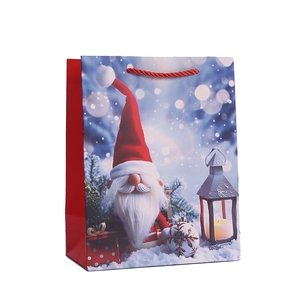 Sac cadeau de Noël avec motif gnome, lanterne festive et anses rouges tressées