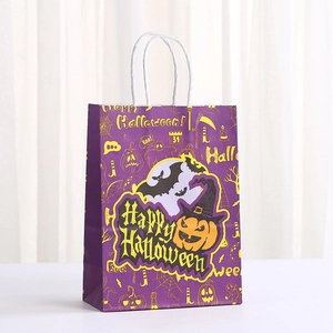 Purple Halloween gift bag with pumpkin and bat prints and white paper handles