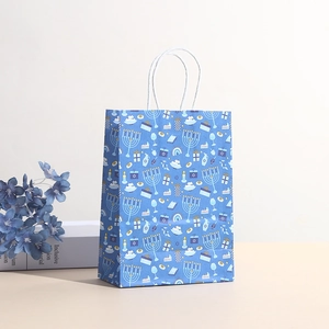 Hanukkah kraft paper gift bag with Star of David and Menorah prints with white rope handles
