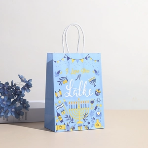 Hanukkah kraft paper gift bag with 'I Love You A Latke' print and white handles