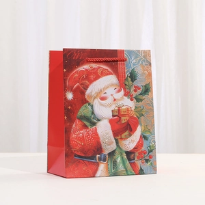 Christmas paper gift bag featuring a Santa Claus illustration with red rope handles