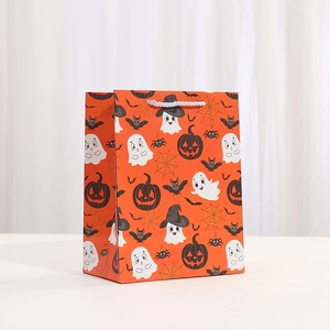 Sac cadeau Halloween orange avec motifs citrouille et fantôme et poignées blanches tissées
