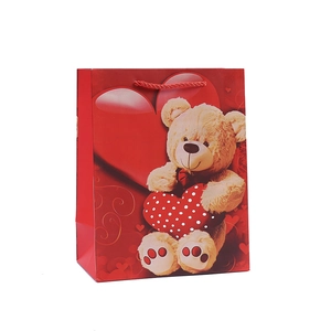 Sac cadeau en papier rouge avec motif ours en peluche et cœur pour les fêtes