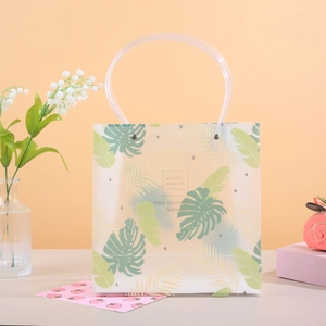 Frosted semi-transparent PP gift bag with tropical leaf print and round handle
