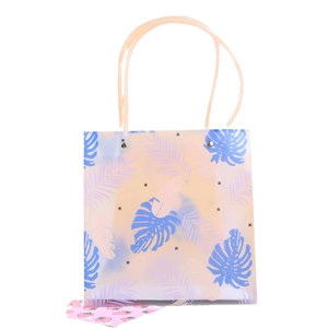 Frosted plastic gift bag with tropical monstera leaves and transparent handles