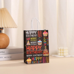 Sac cadeau en papier kraft noir avec motifs Happy Birthday colorés et anses blanches