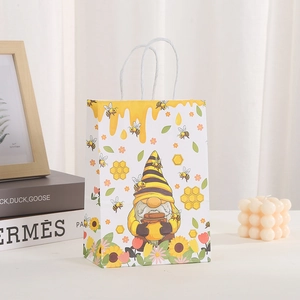 Detail der Bienen-Gnom-Partytüte mit gelben Honigtropfen und Sonnenblumen-Prints