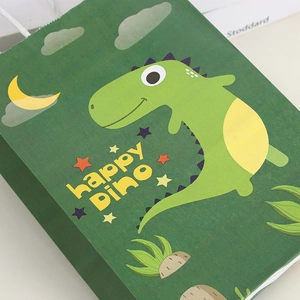 Green kraft paper gift bag featuring a cartoon dinosaur print and sturdy white rope handles