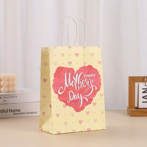 Yellow Mother's Day kraft paper gift bag with rose heart print and white rope handles