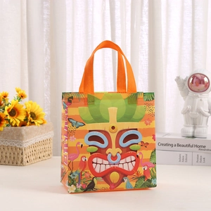 Waterproof non-woven gift bag with orange Tiki print and tropical flamingo patterns