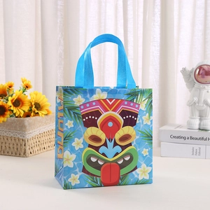 Blue non-woven Tiki gift bag with tropical flowers and Aloha print for parties