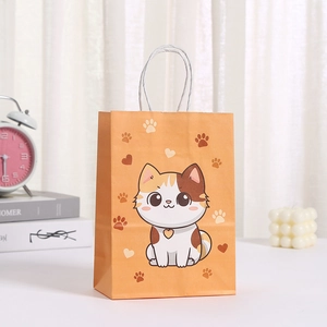 Bolsa de regalo de papel kraft naranja con estampado de gato y asas trenzadas blancas