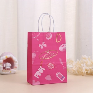 Detailed view of pink gift bag with crown prints and white twisted rope handle