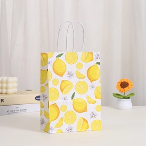 White kraft paper shopping bag with fresh lemon print and white twisted rope handles